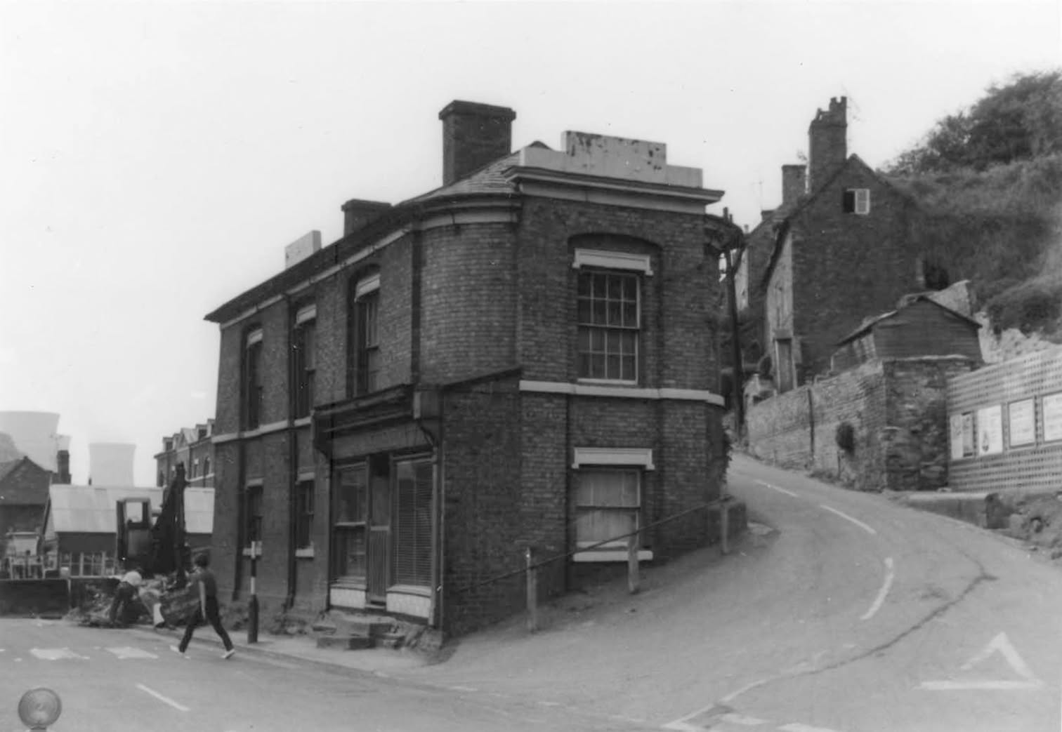 Historic photograph of the road and buildings before the present road layout.