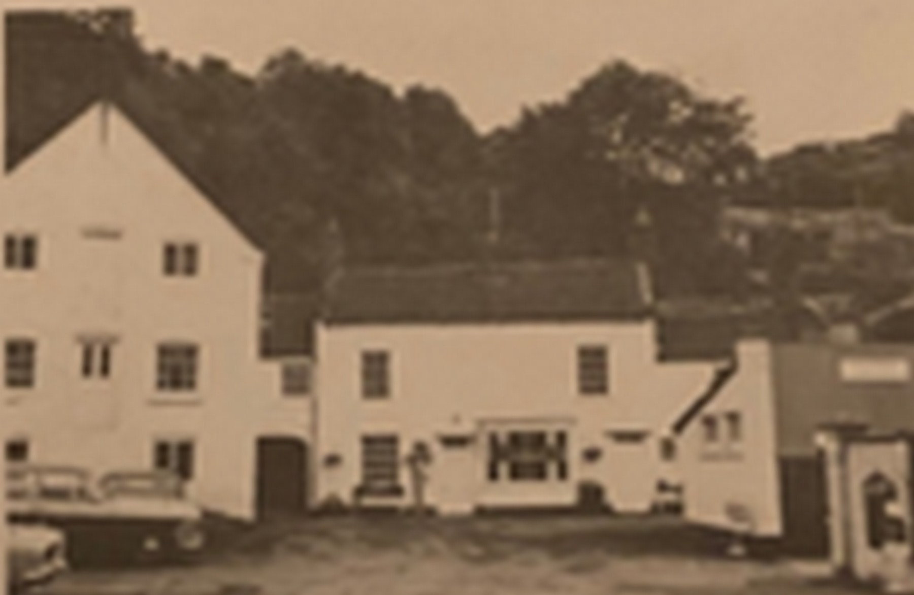 The Talbot and the tall warehouse beside it, seen across the open forecourt.